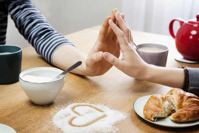 Two hands touching over table